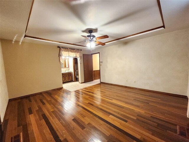 1116 Reid Cir, Seminole, OK 74868 - empty room with hardwood / wood-style flooring, ceiling fan, and baseboards