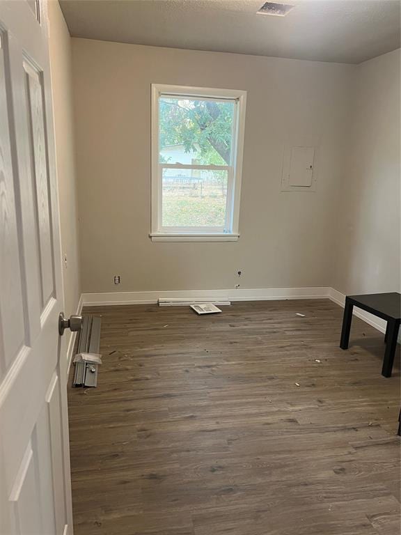 unfurnished room featuring dark hardwood / wood-style floors