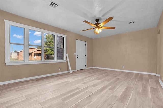 unfurnished room with ceiling fan and light hardwood / wood-style flooring