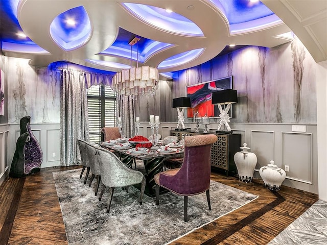 dining space with a notable chandelier and dark hardwood / wood-style floors