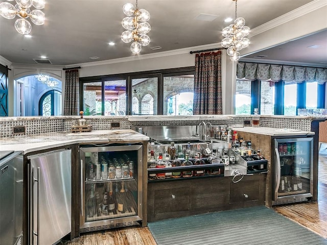 bar with hardwood / wood-style flooring, backsplash, and beverage cooler