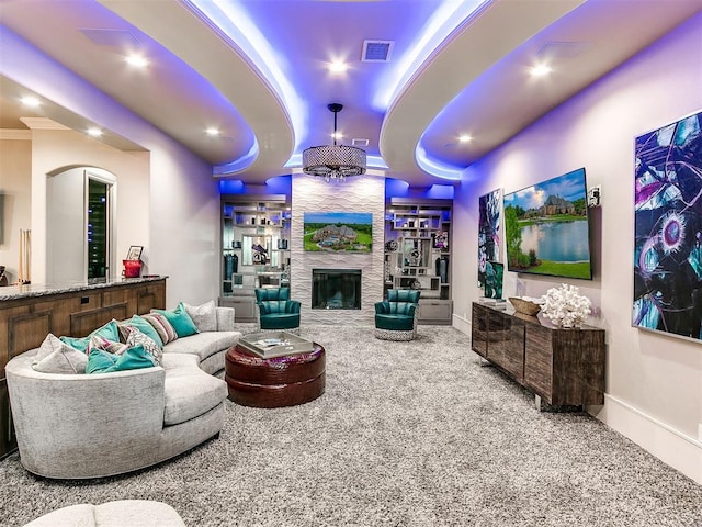 carpeted living room featuring a fireplace and ornamental molding