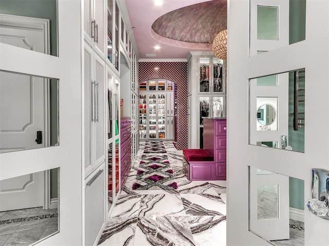 mudroom featuring crown molding