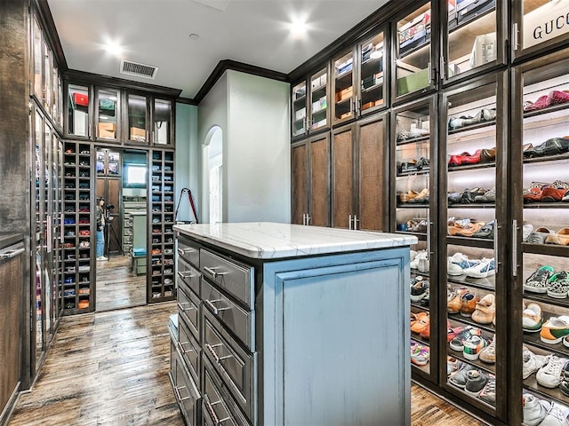 walk in closet featuring hardwood / wood-style flooring