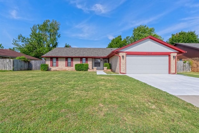 single story home with a front yard and a garage