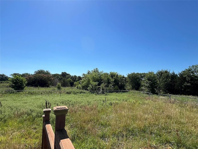 view of yard with a rural view