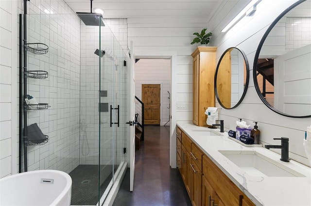 bathroom with vanity, separate shower and tub, and concrete flooring