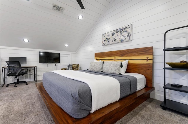 carpeted bedroom featuring ceiling fan, wood walls, lofted ceiling, and wooden ceiling