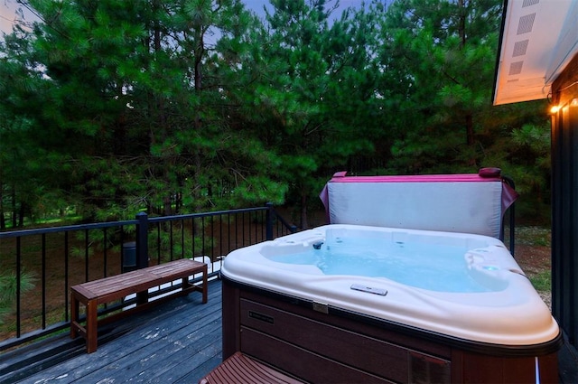 deck featuring a hot tub