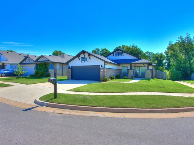 view of front of house featuring a garage and a front lawn