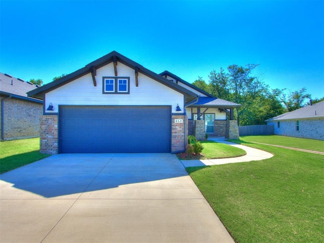 view of front of house featuring a front lawn and a garage