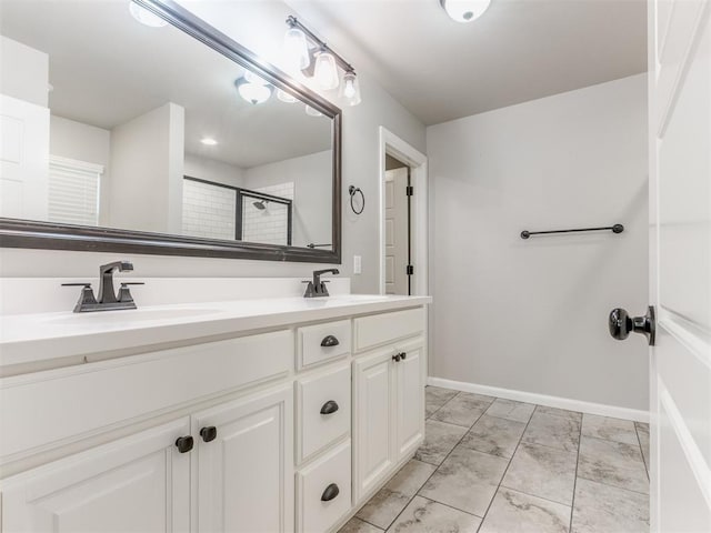 bathroom with vanity and walk in shower