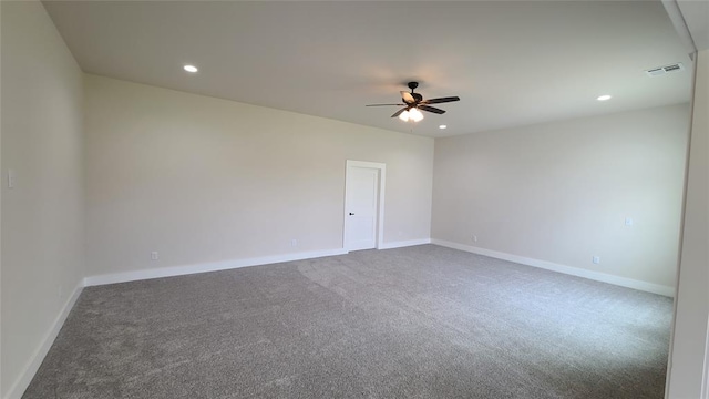 carpeted spare room with ceiling fan