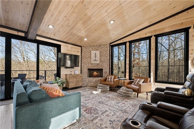 living room featuring a fireplace, lofted ceiling with beams, hardwood / wood-style flooring, and wooden ceiling