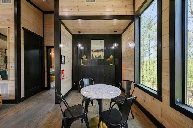 sunroom with beam ceiling and wood ceiling