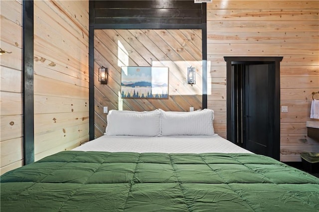 bedroom with wooden walls