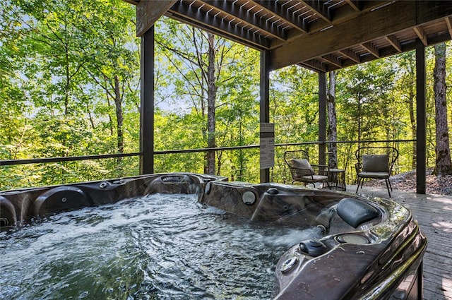 unfurnished sunroom featuring a jacuzzi