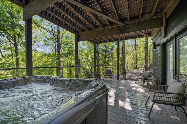 deck with a hot tub