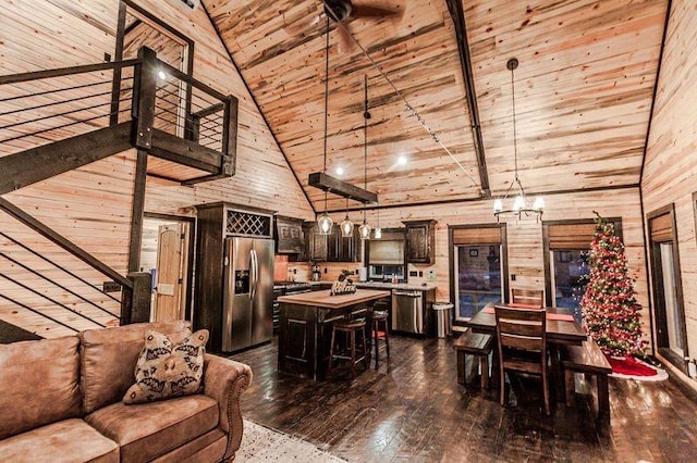 living room with beamed ceiling, high vaulted ceiling, dark hardwood / wood-style floors, and wooden walls