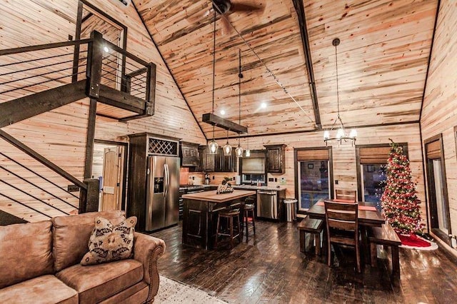21 Mayflower Cir, Broken Bow, OK 74728 - living room featuring high vaulted ceiling, dark wood-type flooring, wood walls, and wooden ceiling