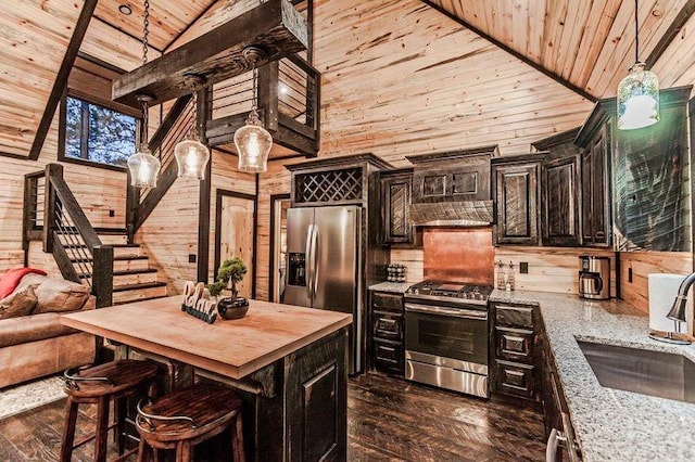 21 Mayflower Cir, Broken Bow, OK 74728 - kitchen with stainless steel appliances, a sink, wood ceiling, wooden counters, and wooden walls
