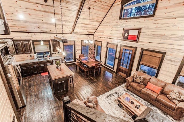 21 Mayflower Cir, Broken Bow, OK 74728 - living area featuring wooden walls, high vaulted ceiling, dark wood-type flooring, wood ceiling, and french doors