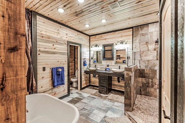 bathroom with wood ceiling, wood walls, a bidet, and a bath