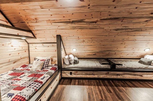 unfurnished bedroom featuring wooden walls, wood ceiling, and dark hardwood / wood-style floors