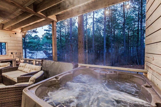 21 Mayflower Cir, Broken Bow, OK 74728 - wooden terrace featuring a hot tub and an outdoor living space