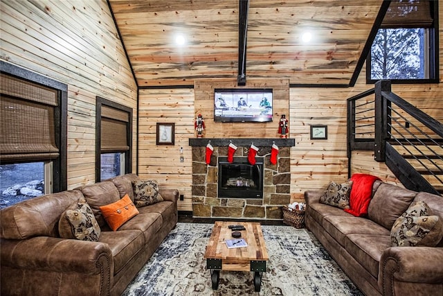 living room featuring a stone fireplace, high vaulted ceiling, wooden ceiling, and wood walls