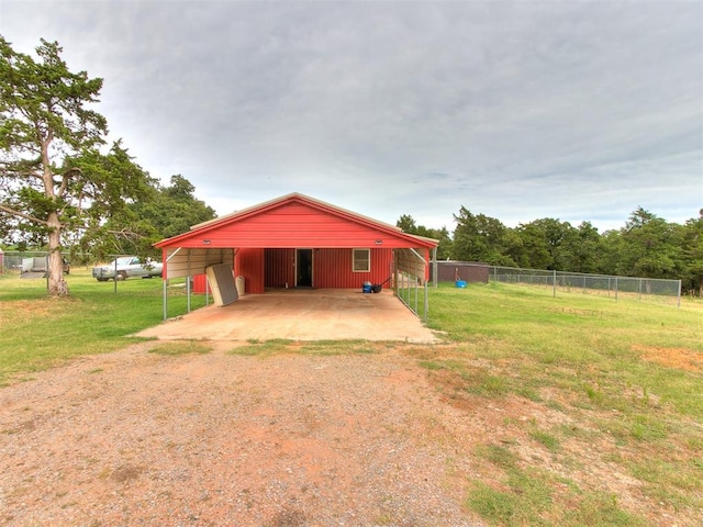 rear view of house featuring an outbuilding