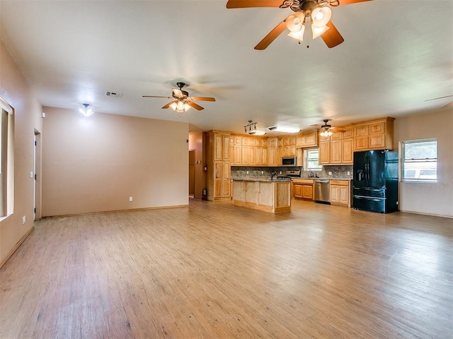 unfurnished living room with light hardwood / wood-style flooring