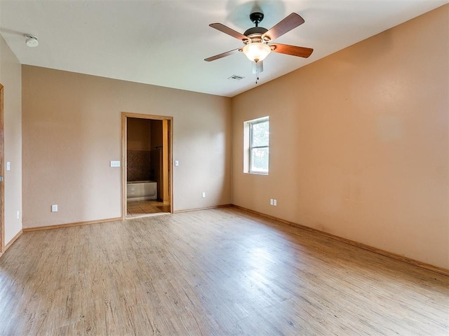 empty room featuring light wood-type flooring and ceiling fan