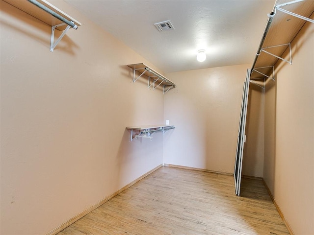 spacious closet with light wood-type flooring