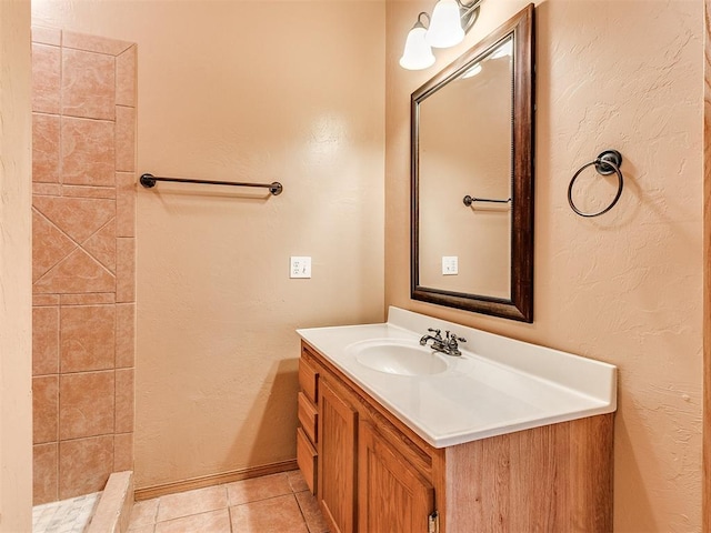 bathroom with tile patterned flooring and vanity