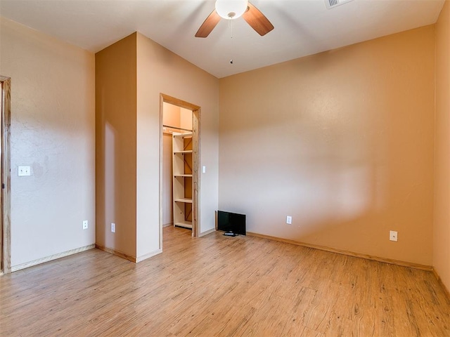 unfurnished room featuring ceiling fan and light wood-type flooring