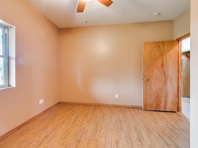 unfurnished room featuring ceiling fan and light wood-type flooring