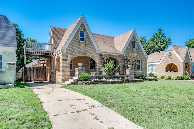 tudor house with a front yard