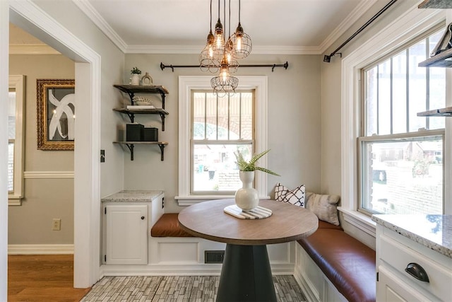 dining space featuring breakfast area, plenty of natural light, and light hardwood / wood-style flooring