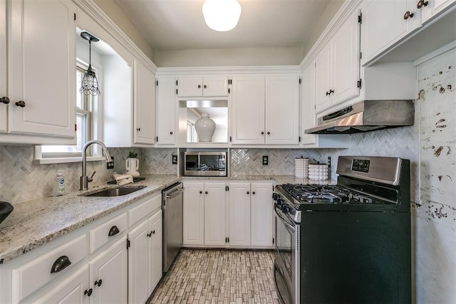 kitchen featuring sink, white cabinets, range hood, and appliances with stainless steel finishes