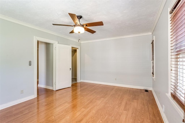 unfurnished bedroom featuring ornamental molding, a textured ceiling, ceiling fan, light hardwood / wood-style floors, and a closet