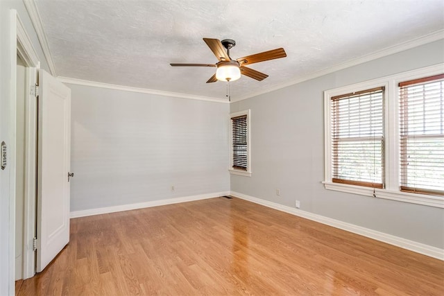 unfurnished room with a textured ceiling, ceiling fan, light wood-type flooring, and crown molding