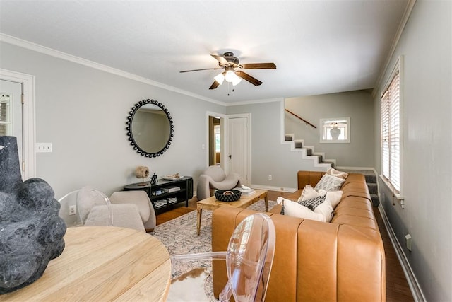 living room featuring wood-type flooring, ceiling fan, and crown molding