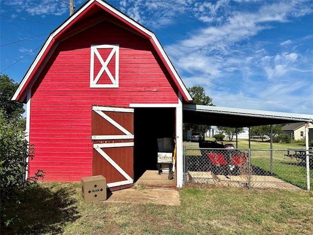 view of outdoor structure with a lawn