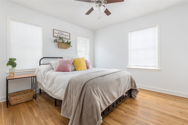 2109 NW 36th St, Oklahoma City, OK 73112 - bedroom featuring wood finished floors, baseboards, and a ceiling fan