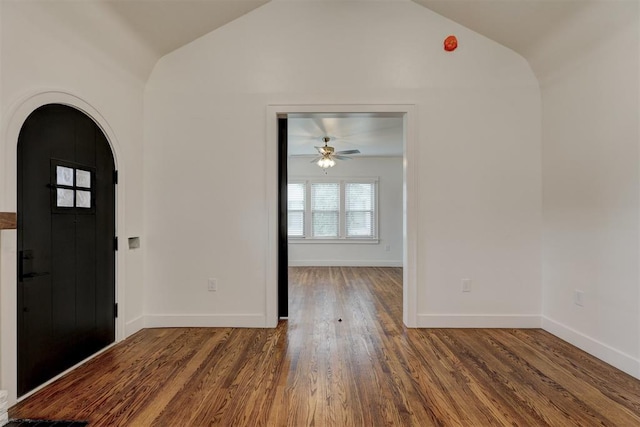 foyer entrance with ceiling fan, hardwood / wood-style floors, and lofted ceiling