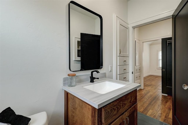 bathroom featuring vanity and hardwood / wood-style flooring