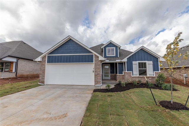 view of front of home with a garage and a front yard