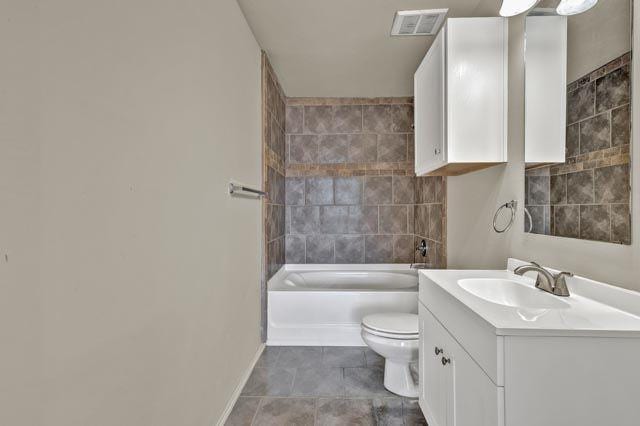 full bathroom featuring tile patterned flooring, shower / washtub combination, vanity, and toilet