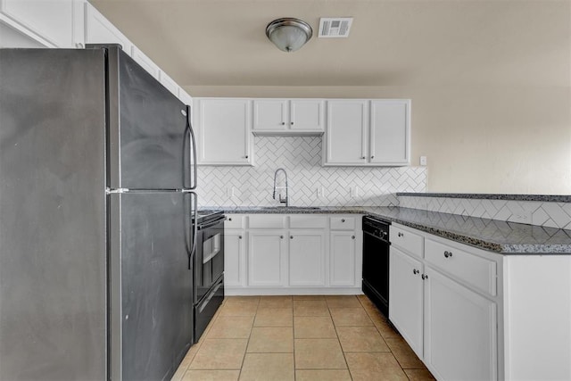 kitchen featuring sink, white cabinets, black appliances, and light tile patterned floors